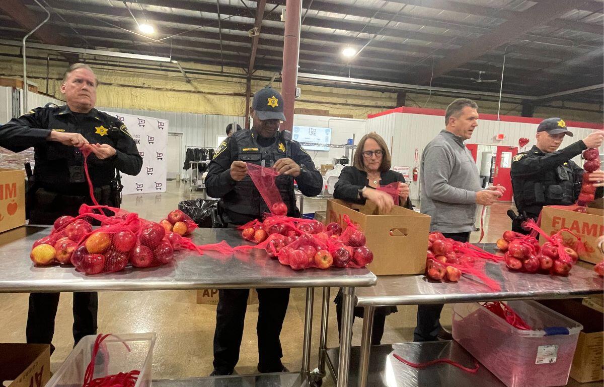 Local law enforcement spent the day repacking food for the Eastern Illinois Foodbank