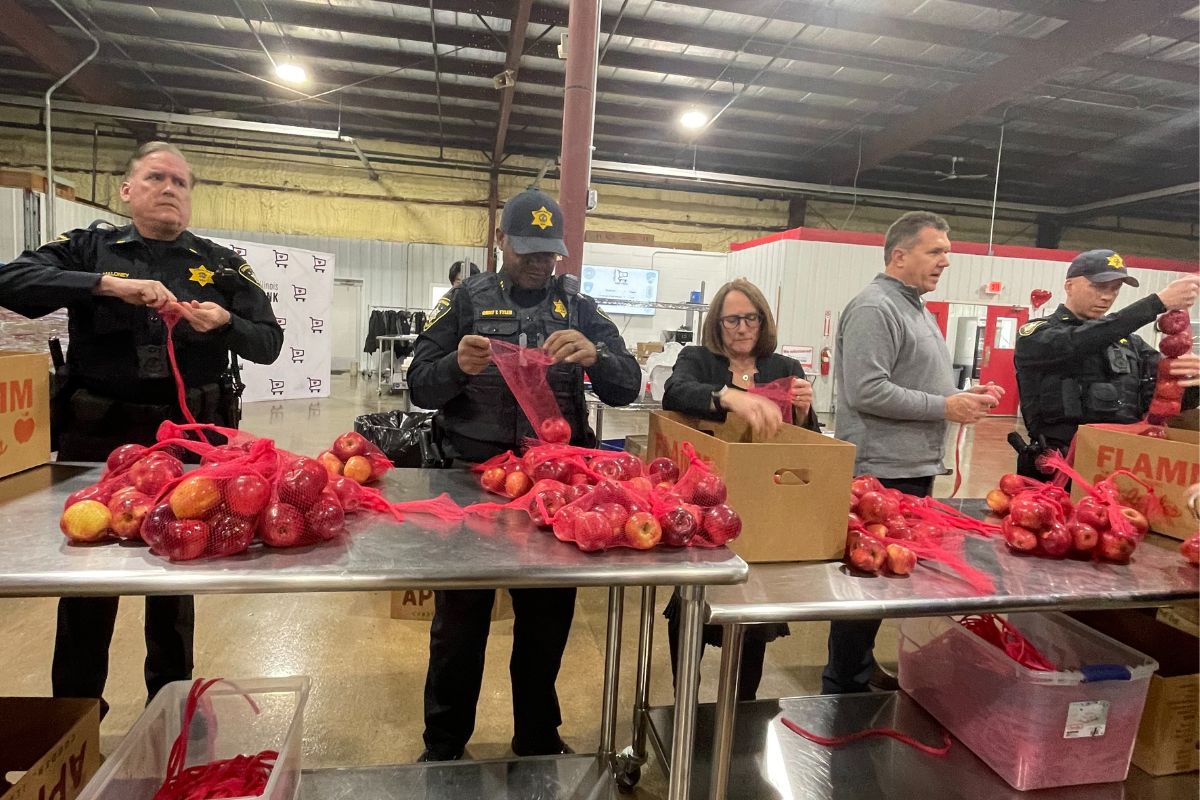 Local law enforcement spent the day repacking food for the Eastern Illinois Foodbank