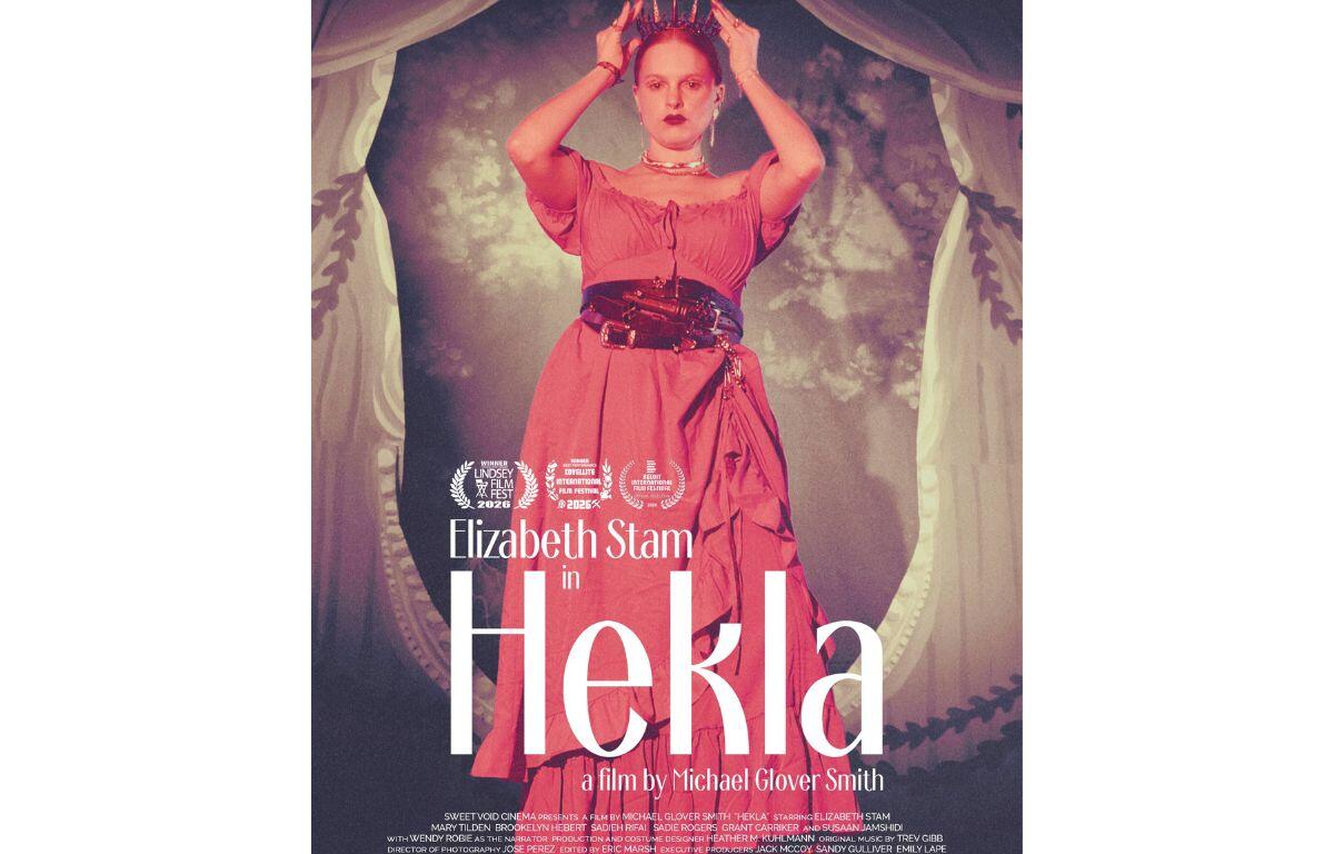 Poster for the film Hekla featuring Elizabeth Stam in a pink dress, wearing a crown, with a theatrical backdrop.