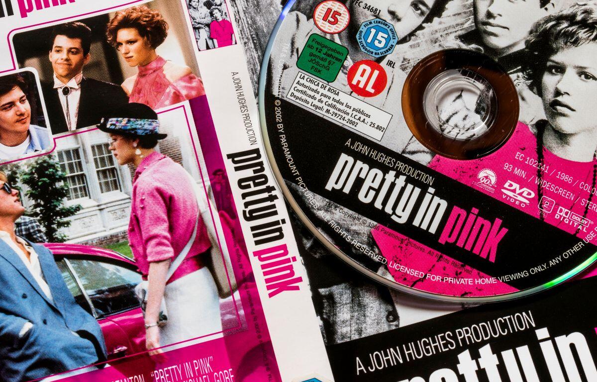 Collage of Pretty in Pink DVD cover and promotional photos with pink design elements.