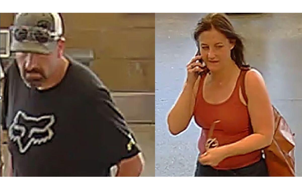 Two people: left—man in a black Fox t-shirt and camo cap looking downward; right—woman in a red tank top on a cellphone with a brown backpack.