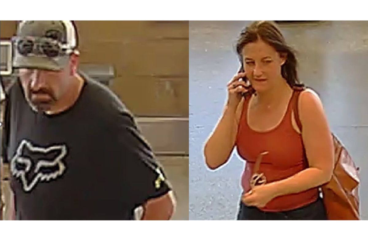 Two people: left—man in a black Fox t-shirt and camo cap looking downward; right—woman in a red tank top on a cellphone with a brown backpack.