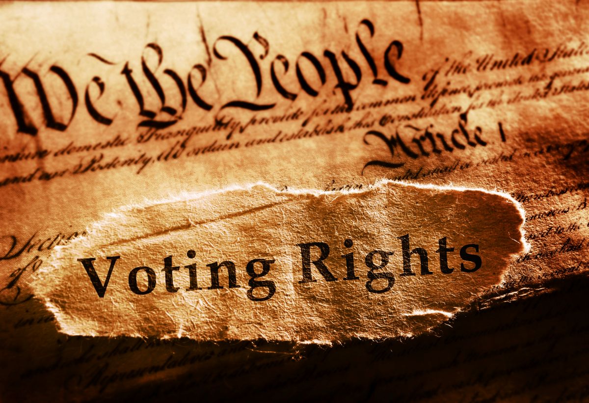 Torn parchment revealing the words 'Voting Rights' with a faded U.S. Constitution backdrop.