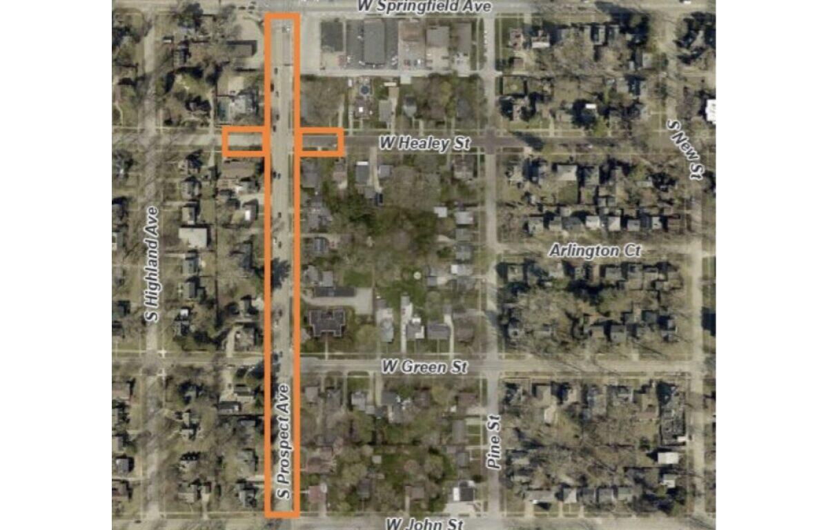 Aerial map with an orange outline highlighting a long vertical strip along S Prospect Ave from W John St upward near W Springfield Ave in a residential area.