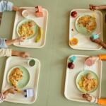Four kids at a cafeteria. Cunningham Children's Home is renovating their cafeteria and fundraising to pay for it.